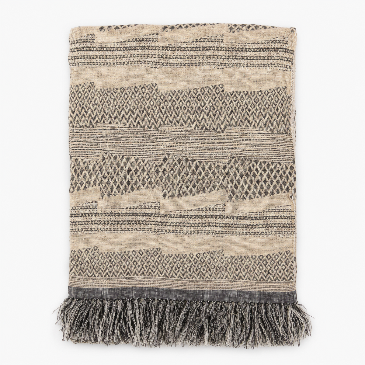 Handwoven linen and silk throw with fringe in a beige, brown and grey geometric pattern