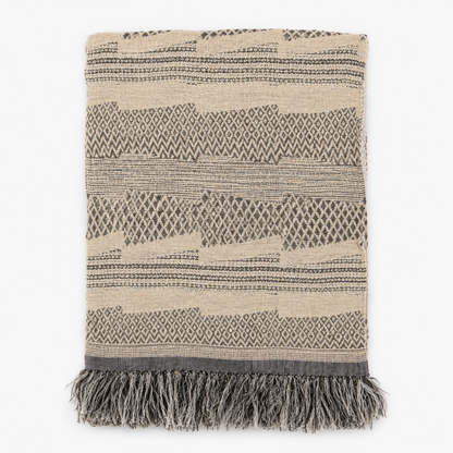 Handwoven linen and silk throw with fringe in a beige, brown and grey geometric pattern