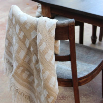 Diwan handwoven linen and silk throw in Laguna draped over a wooden chair