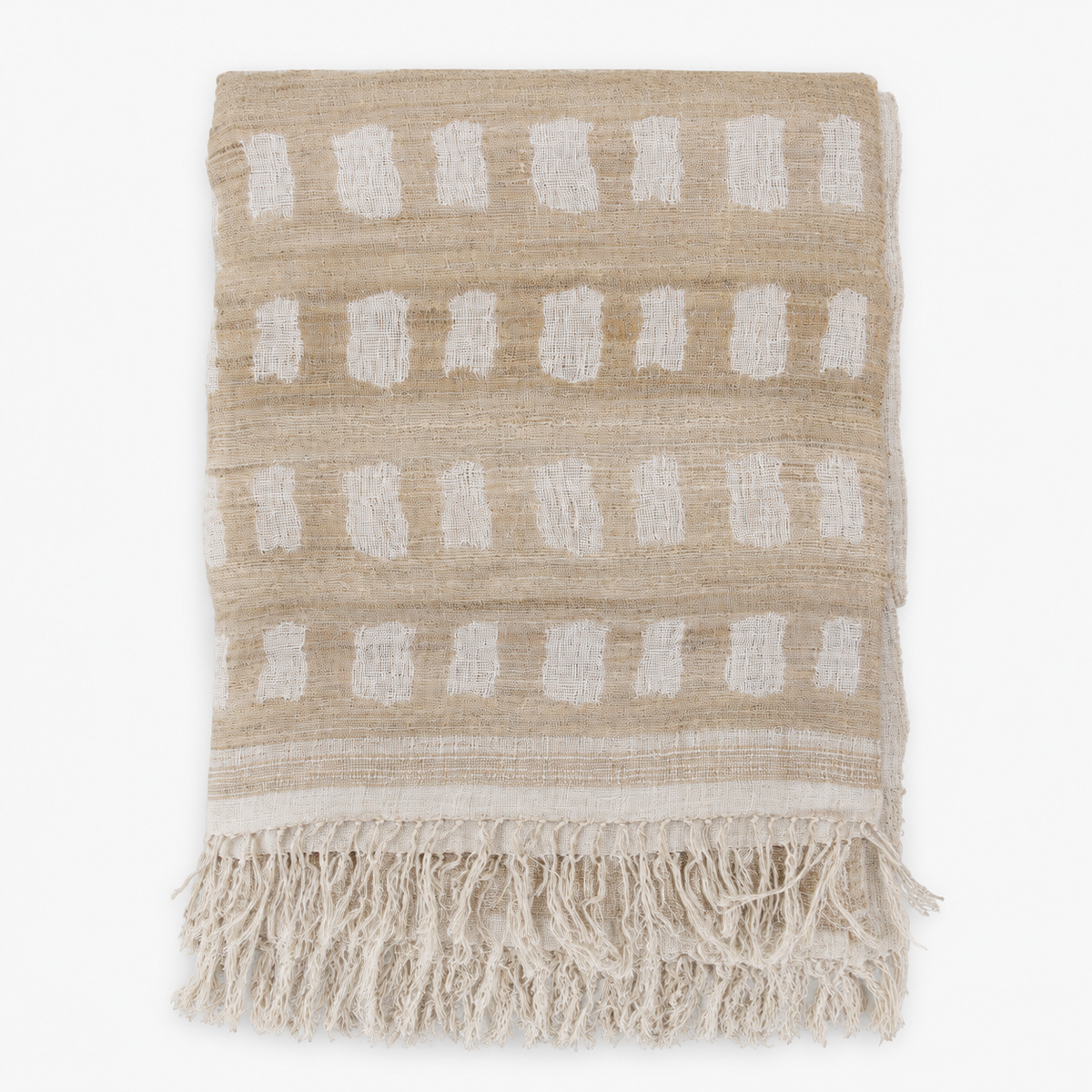 Folded handwoven linen and silk throw with fringe in a beige and off-white block pattern