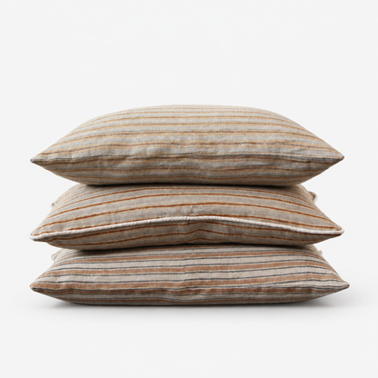 Three Diwan hand block printed linen lumbar covers stacked: Ojai, Del Mar and Montecito stripes