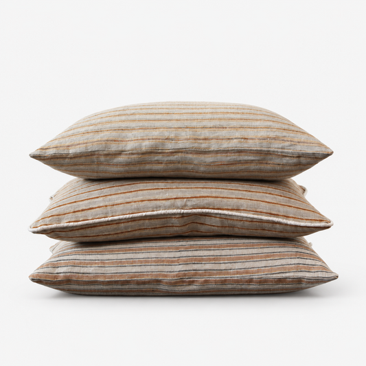 Three Diwan hand block printed linen lumbar covers stacked: Ojai, Del Mar and Montecito stripes