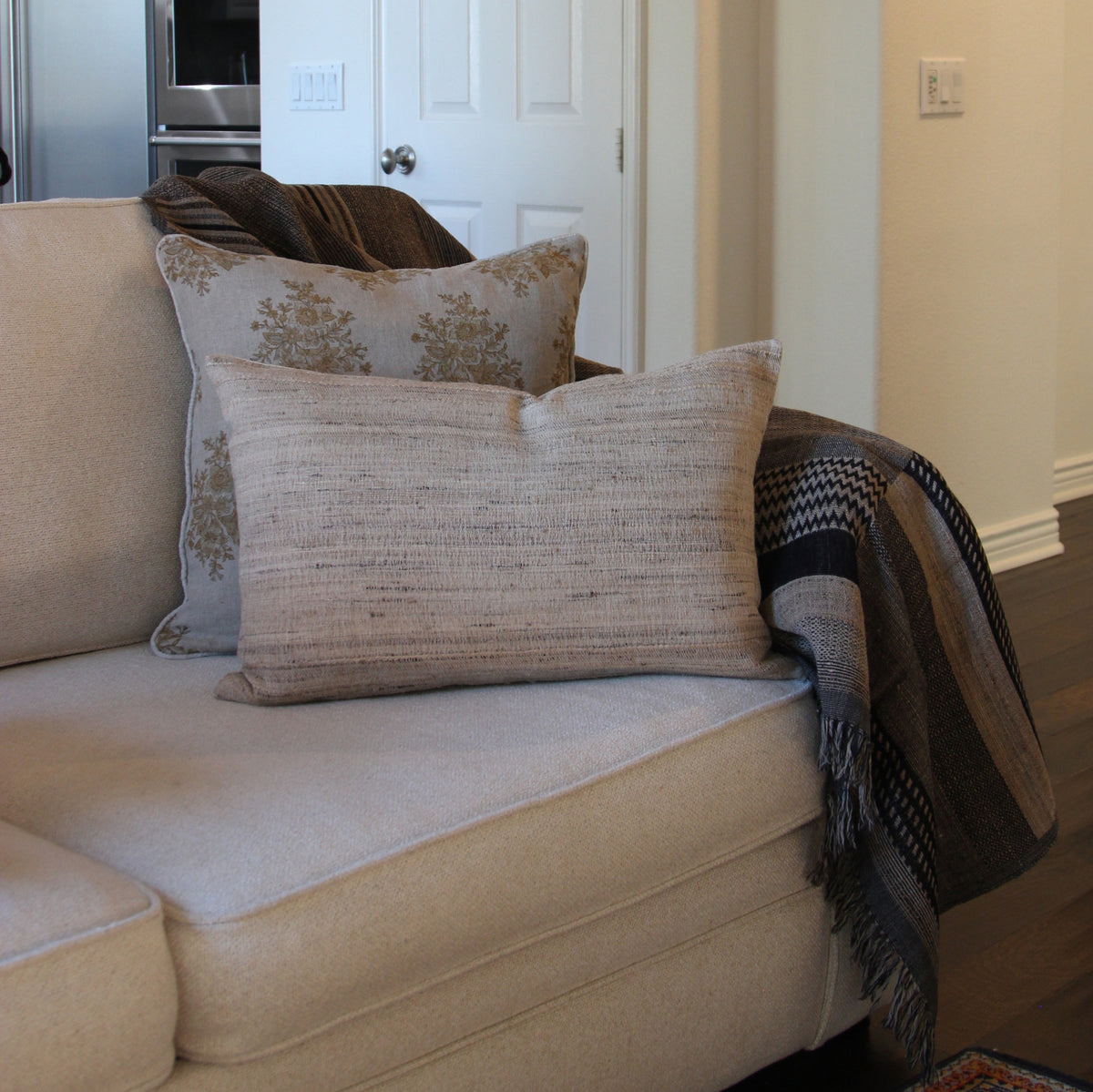 Diwan wool and silk throw in Tahoe with a handwoven lumbar cushion and a hand block printed cushion cover